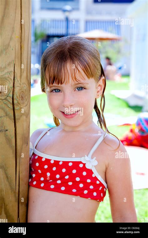 Bikini Kid Girl Water Wet In Pool Garden Holding Sunroof Pole Stock