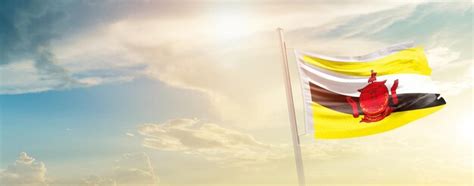 Premium Photo Brunei National Flag Waving In Beautiful Sky