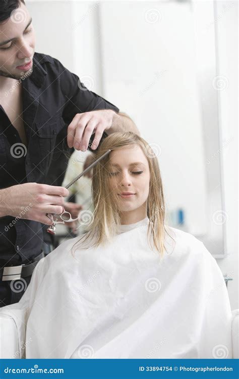 Woman Getting Haircut From Hairdresser At Salon Stock Photo Image Of