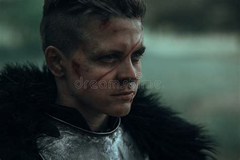 Portrait Of Medieval Knight In Armour With Face Scar Stock Image