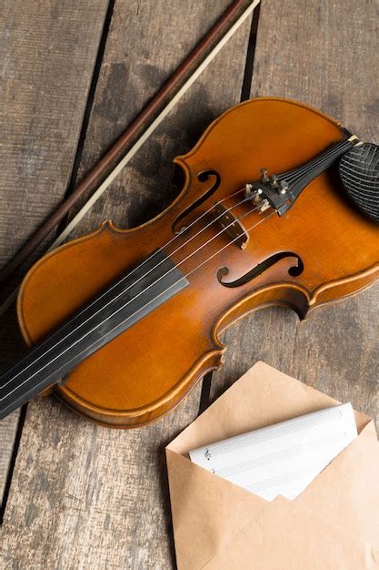 Premium Photo Sheet Music And Violin On Wooden Table