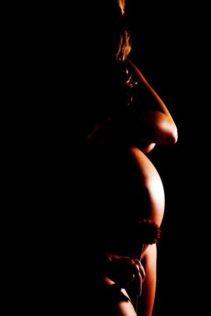Premium Photo Naked Pregnant Woman Standing Against Black Background