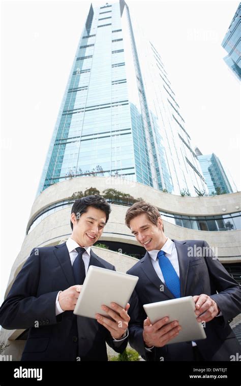 two business men talking outside Stock Photo - Alamy