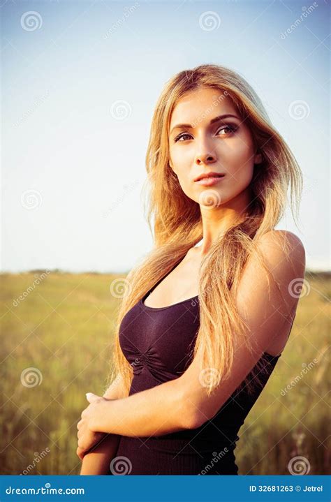 Closeup Portrait Of Cute Blonde Girl Amongst The Field At Sunset Stock Image Image Of Park