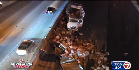 1 Person Hospitalized After Semi Truck Crash Scatters Produce On Street