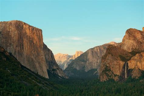 Premium Photo | Yosemite valley at sunset with mountains and waterfalls