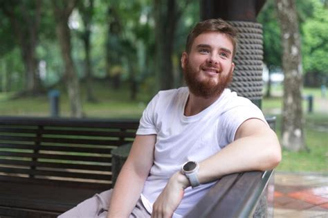 Premium Photo Portrait Happy Handsome Bearded Young Man In The Park