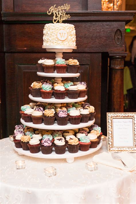 Classic And Colorful Bright Wedding Cake And Cupcake Display By Flavor