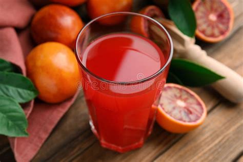 Tasty Sicilian Orange Juice In Glass Fruits And Squeezer On Wooden