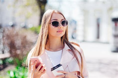 Upper Class Woman Fashionable Woman Texting Outdoors Fashion Woman In A Sunglasses And Pink