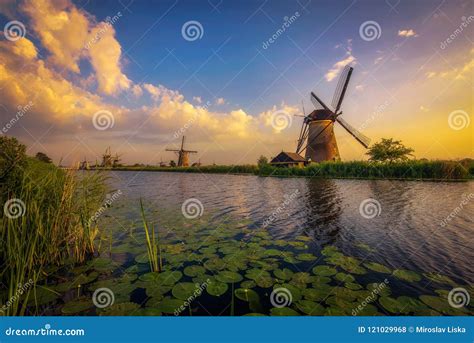 Sunset Above Old Dutch Windmills in Kinderdijk, Netherlands Stock Photo ...