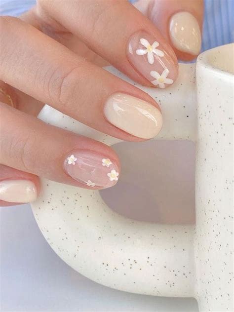 A Woman S Hands With French Manies And Flowers On Them Holding A