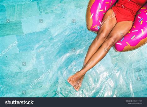 Suntan Vacation Swimming Pool Woman Relaxing Floating On Donut Float In