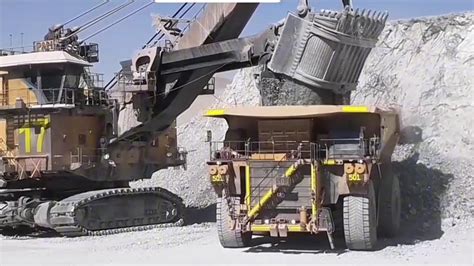 Loading Large Scale CAT 798AC And Komatsu 980E Extraction Trucks YouTube