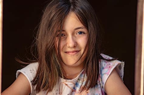 Premium Photo Close Up Portrait Of Cute Smiling Girl At Home