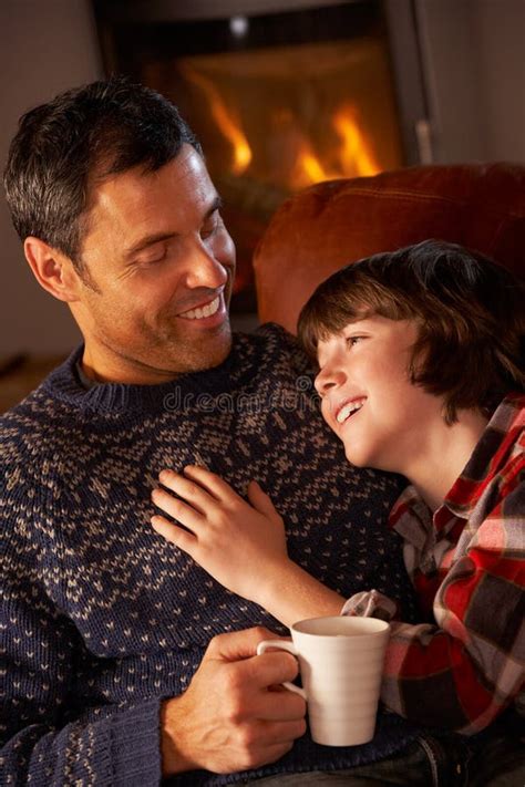 Father And Son Relaxing With Hot Drink Stock Photo Image Of Drinking People