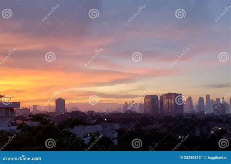 Golden Sunset Sky With Modern Urban Buildings In The Background Stock