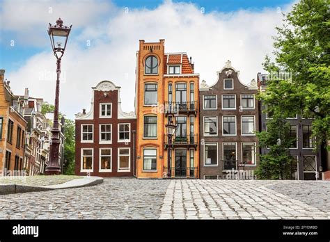 Traditional Dutch houses in the historic city of Amsterdam. Famous and ...