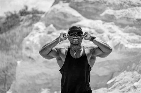 Strong Muscle Man Standing Outdoor With Naked Torso Shirtless Guy On A Backgroung Of Landscapes