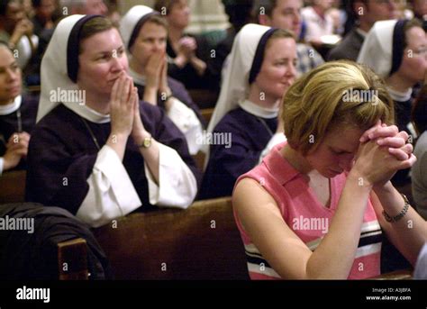 Catholic Nuns and parishioners pray at St Patrick s Cathedral Stock ...