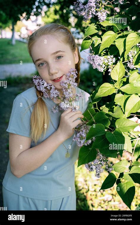 Portrait Of A Beautiful Girl Of Years Old With Long Blonde Hair The Girl With Braids Looks