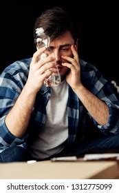 Handsome Man Suffering Hangover Holding Bottle Stock Photo 1312775099 | Shutterstock