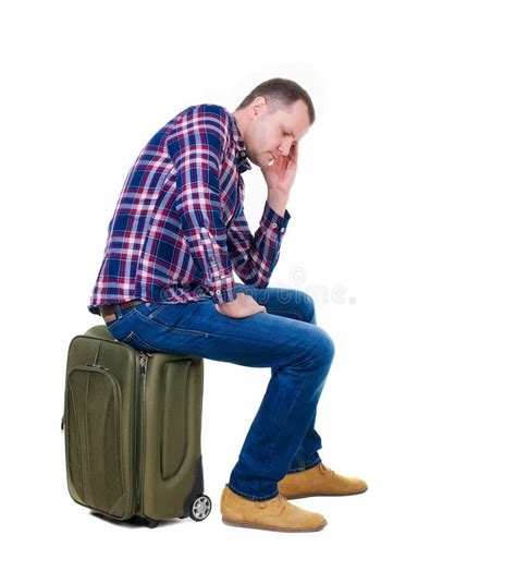 Back View Of A Man Sitting On A Suitcase Stock Image Image Of