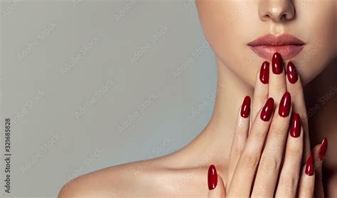 Beautiful girl . Model woman showing red shellac manicure on nails ...