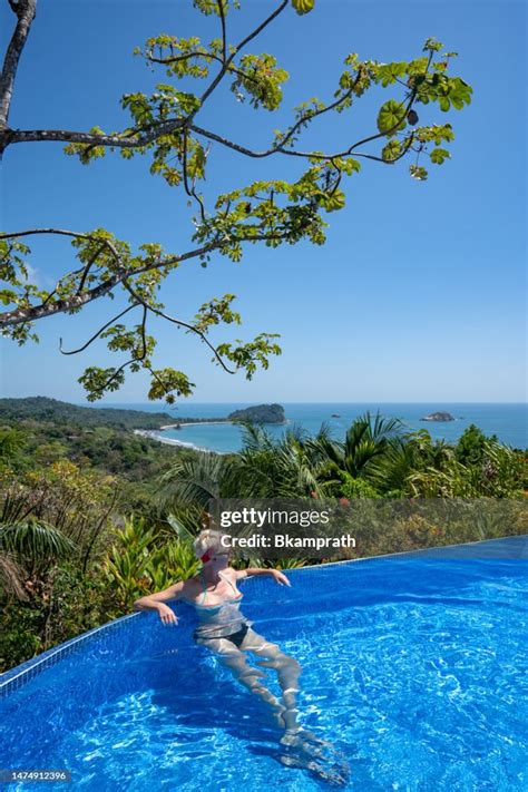 Woman Relaxing Above The Wild Untamed Coastal Beauty Of Manuel Antonio ...