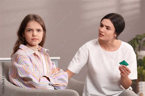 Mother Talking With Her Teenage Daughter About Contraception At Home Sex Education Concept