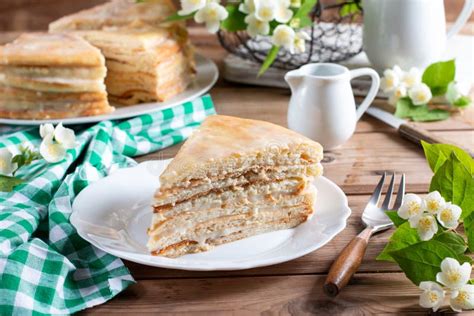 Homemade Naked Layered Vanilla Cake With Whipped Cream On A Wooden