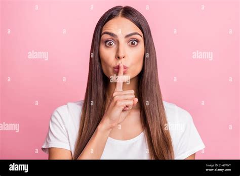 Photo Of Impressed Young Brunette Lady Finger Mouth Wear White T Shirt