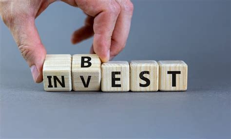 Best Invest Symbol Businessman Turns Wooden Cubes And Changes The Word