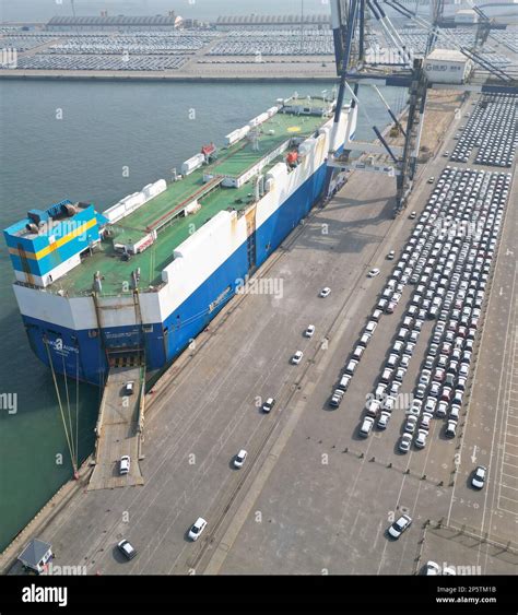 YANTAI CHINA MARCH 7 2023 A Transport Ship Loads Goods Trucks For