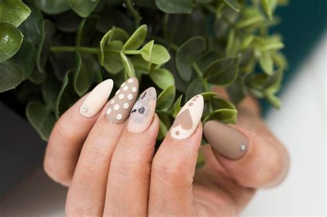 Premium Photo Manicure Drawing On The Nails Nude Nail Polish