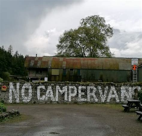 Kclr Live No Campervan Sign Is Painted Across An Ancient Stone Wall