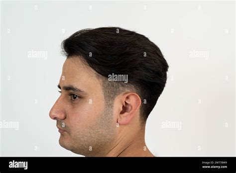 Portrait Of A Brown Skinned Man With Silky Well Groomed Black Hair On