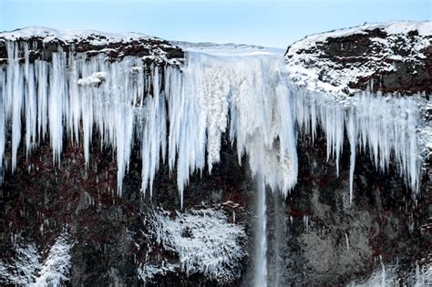 Premium Photo | Frozen waterfall near vik iceland