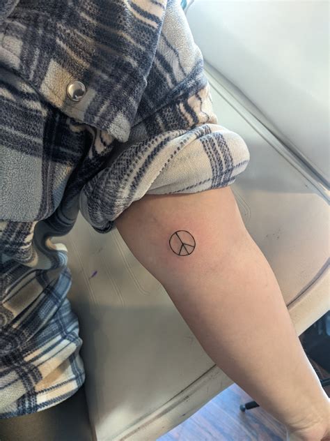 peace logo tattoo 3