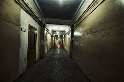 Dark Corridor With Cabinet Doors And Lights With Silhouette Of Spooky