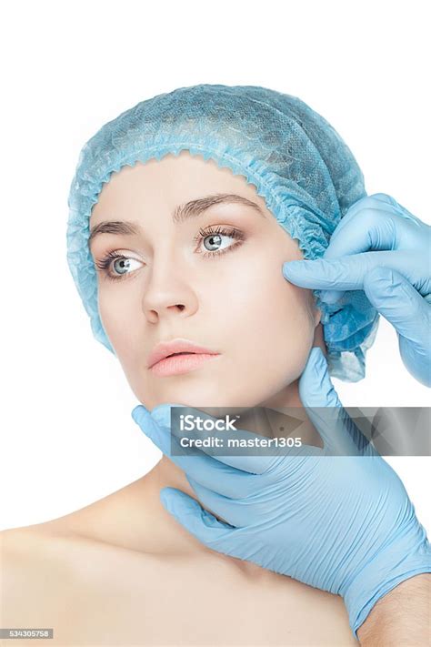 Plastic Surgery Concept Doctor Hands In Gloves Touching Woman Face