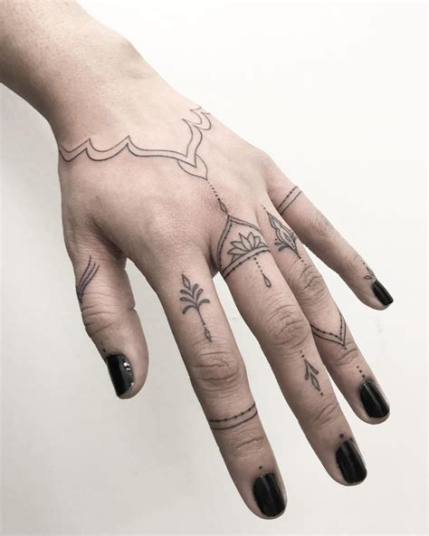 Fine Line Hand Tattoo