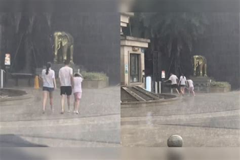 一家人就要整整齐齐一家三口出门突遇暴雨所幸摆烂潇洒淋雨