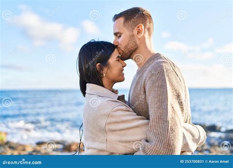 Man And Woman Couple Smiling Confident Hugging Each Other Kissing At