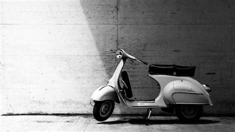 Premium Photo Motor Scooter Parked On Footpath Against Wall