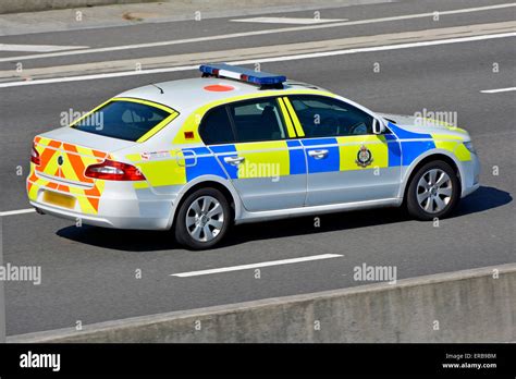 UK Military Police marked police patrol car driving along M25 motorway ...