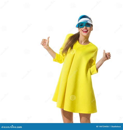 Happy Fashion Model In Yellow Mini Dress Is Showing Thumbs Up Stock