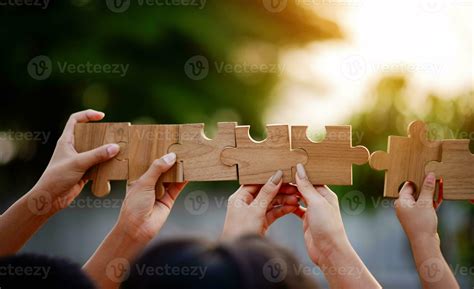 Jigsaw puzzle pieces group together, unite strength, unity, teamwork