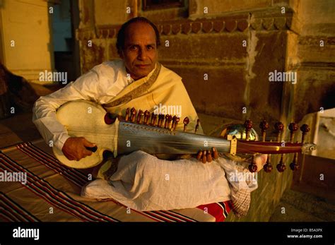 Man playing sarod hi-res stock photography and images - Alamy