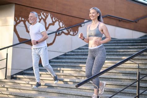 A Mature Couple Having A Morning Jogging Together And Looking Contented Stock Image Image Of